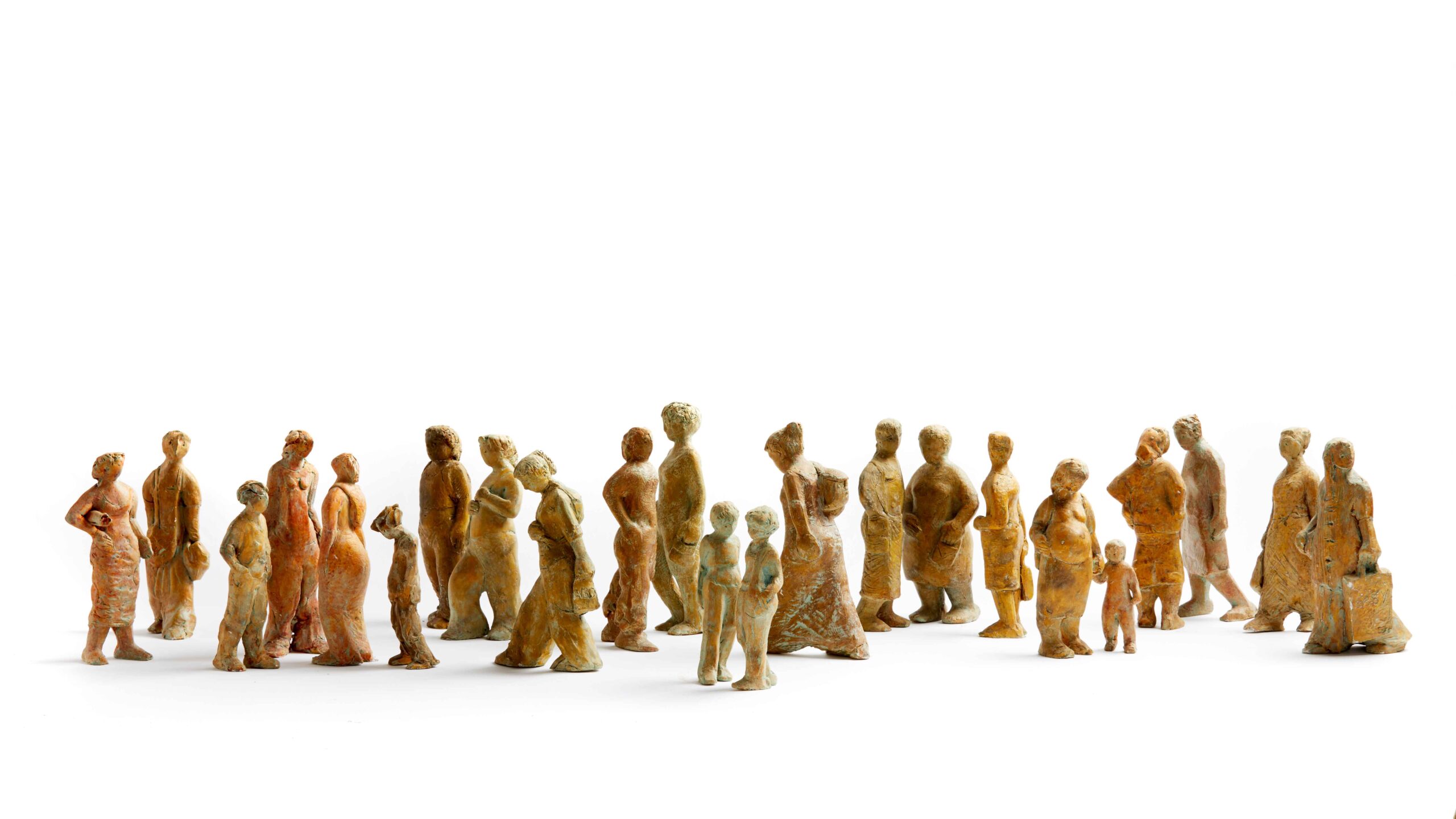 A number of small figures on a white background. An artwork by Bridget Heriz