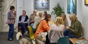 A group of customers chatting in the cafe at South Quay Gallery
